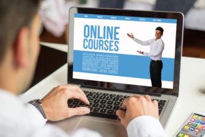 Businessman,Working,With,A,Laptop,,All,Screen,Graphics,Are,Made
