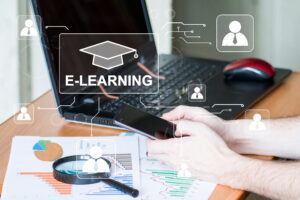 Online,Education,,E-learning.,Young,Man,Is,Sitting,At,Table,,Working